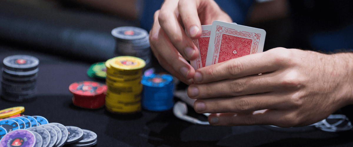 poker player looking at cards