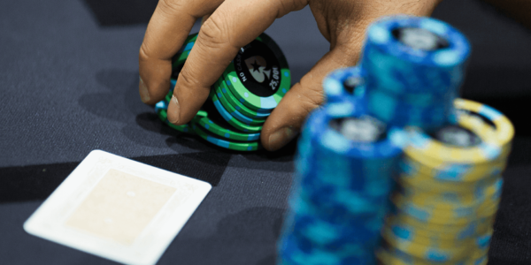 Shuffling green poker chips